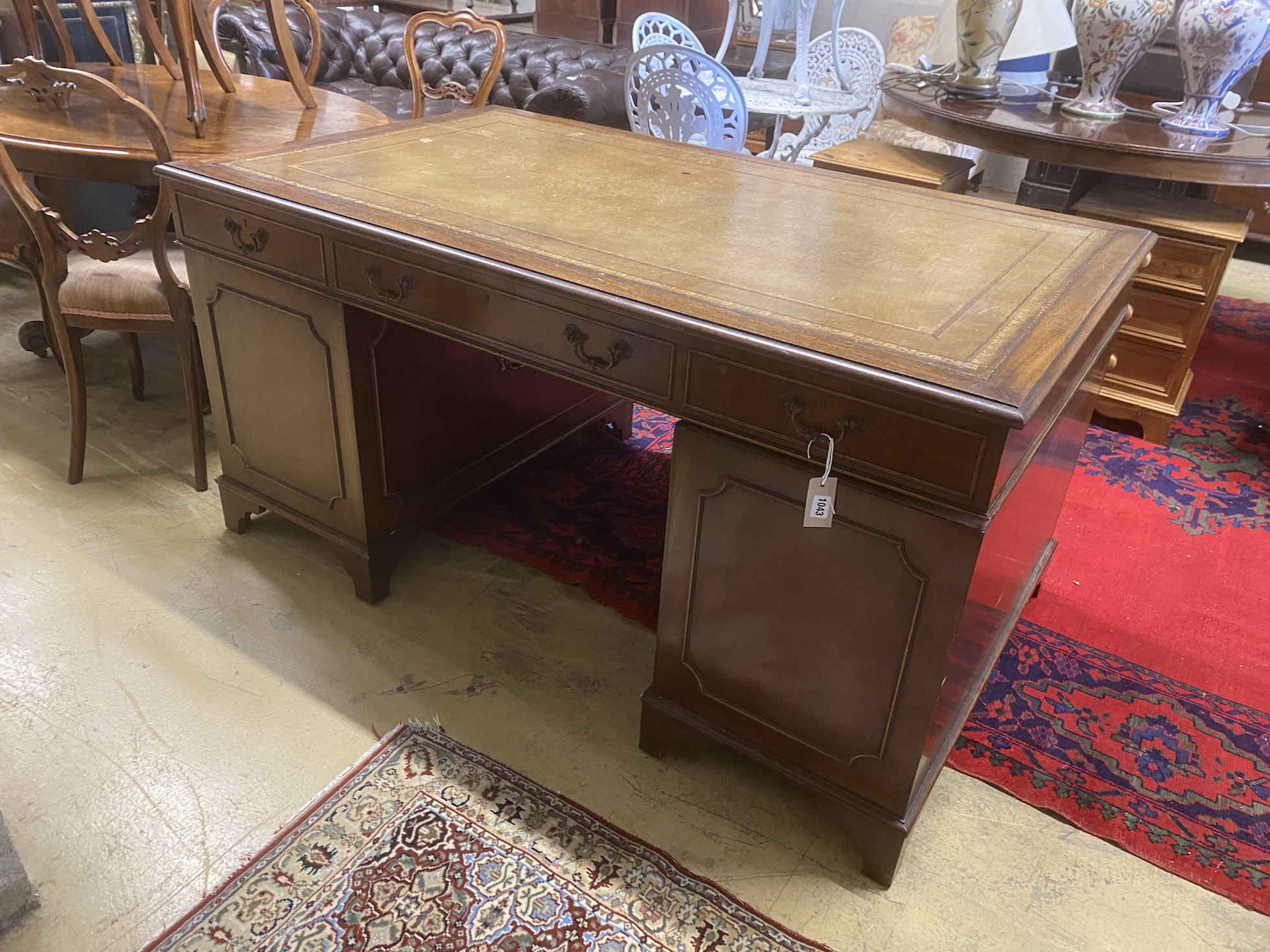 A reproduction George III style mahogany pedestal desk, length 154cm, depth 91cm, height 77cm